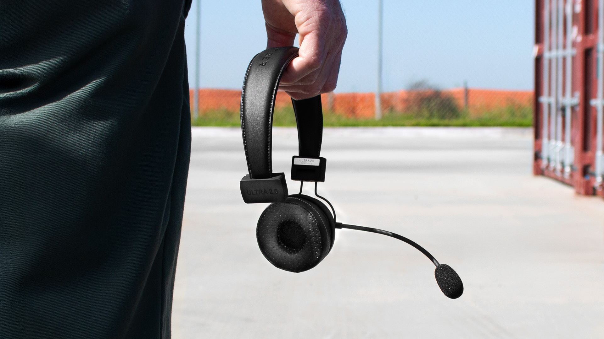 Truck Driver Holding Headset - DCG